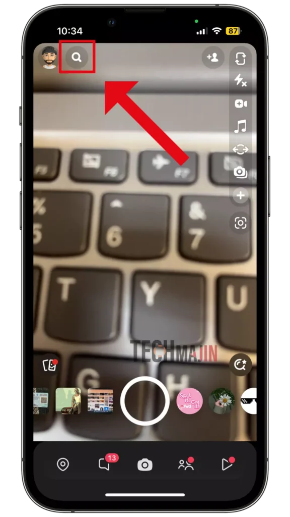 Go to Snapchat and tap the Search icon at the top next to your profile picture